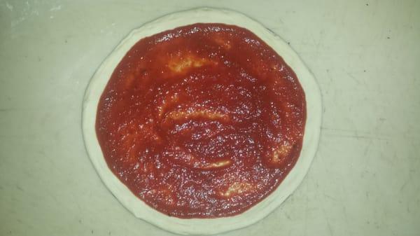 Our hand stretched pizza dough and our families secret pizza sauce recipe.