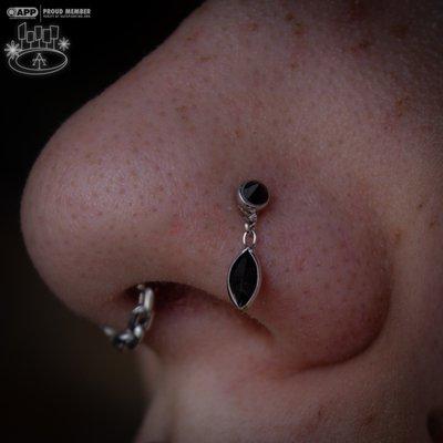 Healed nostril piercing with a cute dangle!  Best jewelry around!