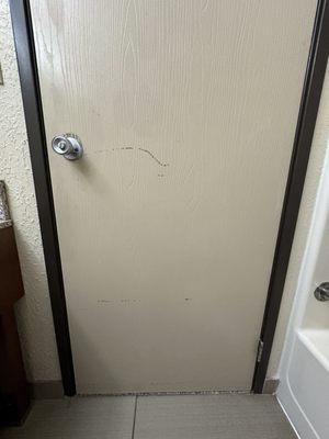 Doors to the tiny bathroom