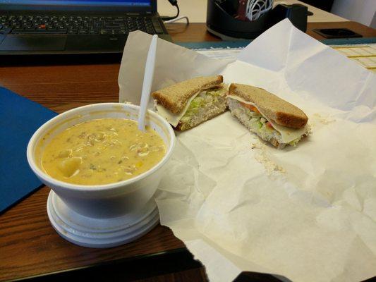 Cheeseburger  chowder featuring a chicken salad sandwich.