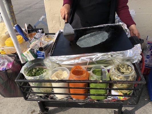 Starting the tortilla on the cart and the fixings