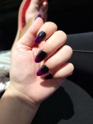 Purple and black ombre dip nails.