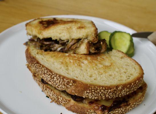 Mushroom melt, toasted to perfection. Take some pickles home!