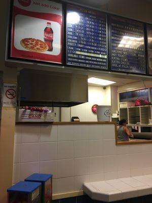 Order pizza by the slice at the counter