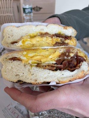 Bacon, over easy egg and cheese on a roll