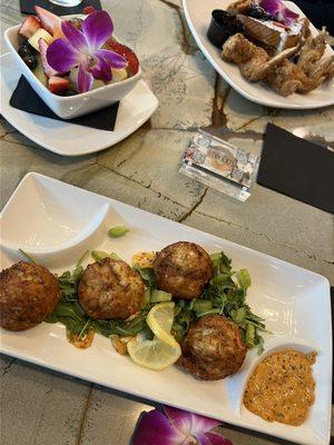 Crab cakes, fruit bowl and French toast with wings