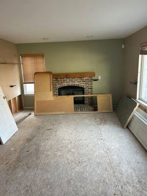 A Milwaukee living room being restored from fire damage