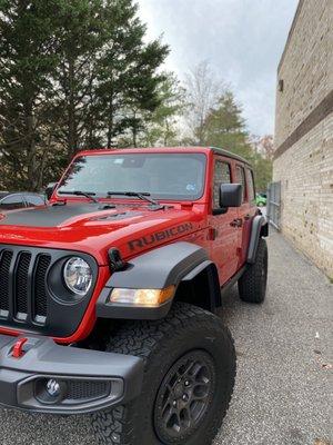 Jeep Wrangler come in for partial hood wrap in matte black from 3m