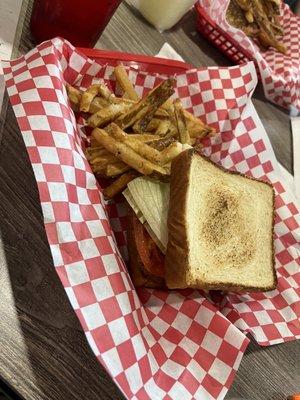 Fried steak sandwich with home style fries.