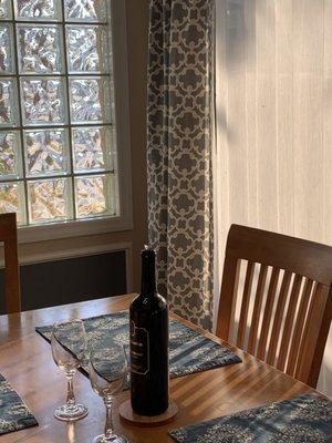 Dining room table with a bottle of red wine from the same Sebastian winery