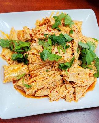 Spicy tofu bean curd with delicious chili oil & garlic dressing. Topped with fresh cilantro. Over the top good. Must try if you like spicy.