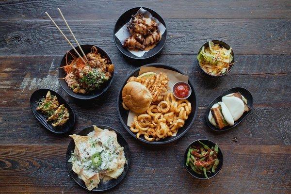 Pork gyoza, tempura shrimp, pork nachos, west wings, hot chicken sandwich, edamame, salad, and pork belly bao buns.