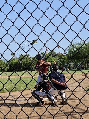 Perfect Sunday in the park watching nephew's baseball game with kites in the background