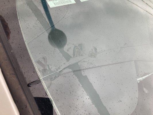 This is the crack that was left in my windshield after coming to this place.