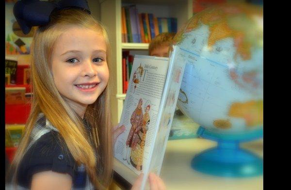 Student reading in the classroom.