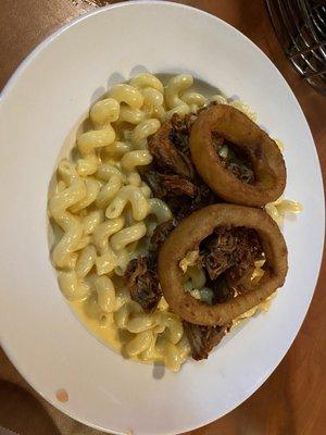 Mac & Cheese with pulled pork & crispy onion rings. Yum!