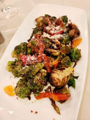 Crispy brussels sprouts, goat cheese crema, crispy bacon polenta crouton, balsamic glaze