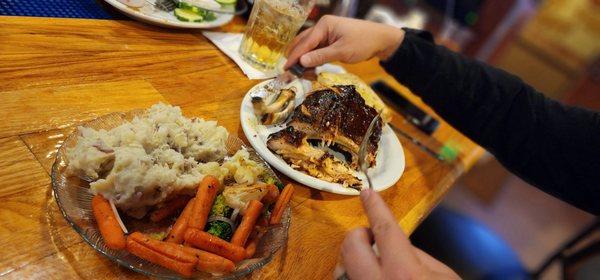 Baby back ribs, mashed potatoes, and veggies