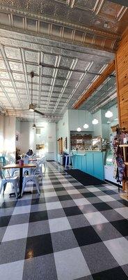 1950's floor pattern and high stamped tin ceiling makes for an open airy feeling.