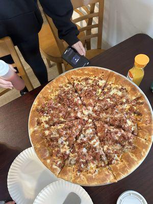 Meat lovers breakfast pizza