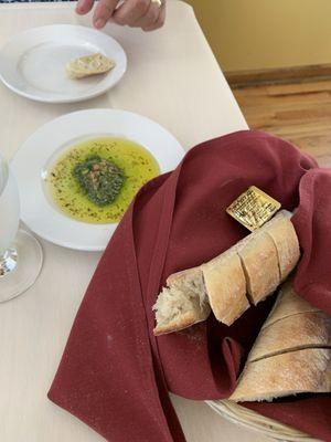 Amazing warm bread and pesto in olive oil.