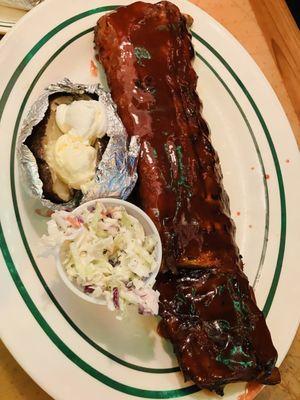 Rack of ribs with baked potato and coleslaw