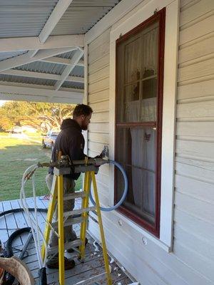 Injecting foam into a wood exterior home