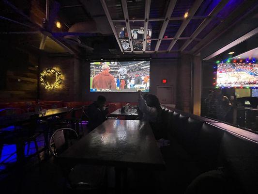 The dining areas, which included Big screen televisions all around the sports bar.