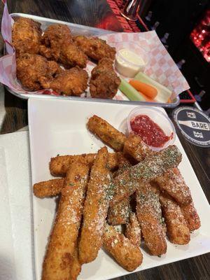 Fried zucchini sticks and chicken wings. On point