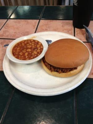 Brisket sandwich with beans.