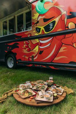 Spice up your day at our food truck with the fiery hot chili pepper logo! Bold flavors, unforgettable bites await you.  #SpiceItUp"