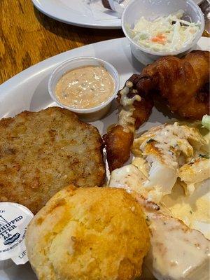 Baked cod, Fried cod, potato pancakes, coleslaw, corn muffin and Cajun tarter sauce.