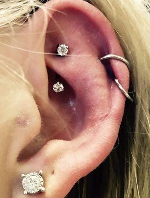 Rook piercing done with double front facing diamonds.