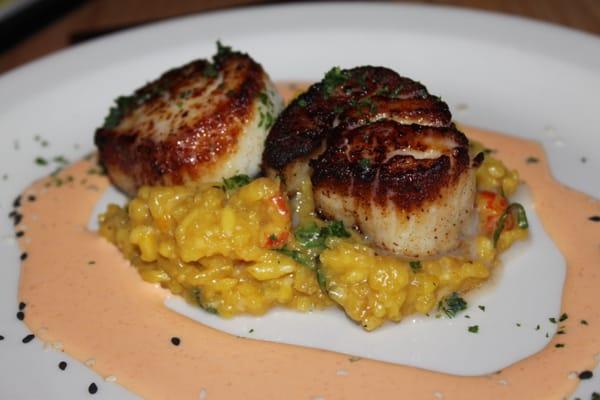 pan seared alaskan sea scallops, crawfish and basil risotto, spicy red pepper cream sauce.