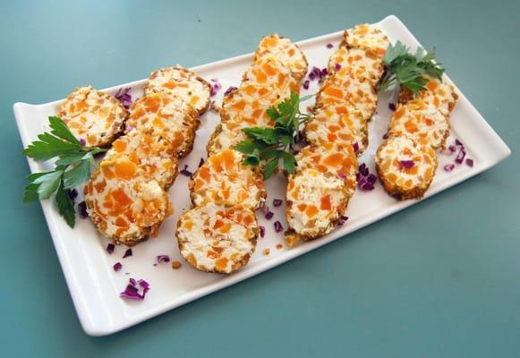 Dried apricot and goat cheese rolled in toasted pistachio nuts