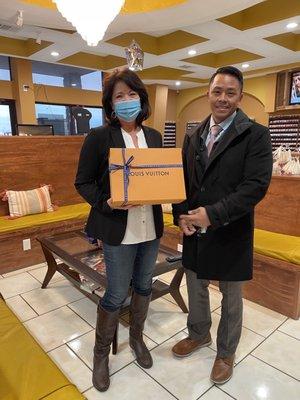 The manager gifting me with the beautiful Louis Vuitton bag I won in the drawing!!!