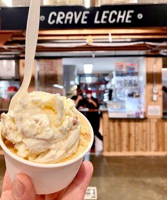 Special seasonal flavors - small 2 scoop dish, apple deep dish (crisp)on top, pumpkin on bottom, friendly staff in background!