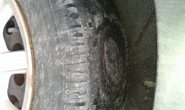 This is a picture of the hole that was burned into my tire when my wheels locked up during the tow, that is being denied.