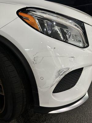 Damage to my vehicle while parked in parking lot.