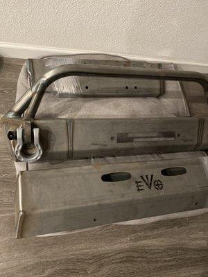 Front bumper and skid plate raw before powder coating.