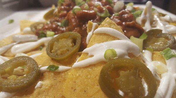 BBQ Nachos Every Day Chicken, Pork or Beef Brisket Choice of toppings includes jalapenos, sour cream, slaw, beans, chili, pickled peppers...