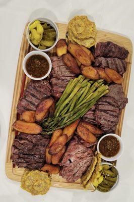 Steak stastinf platter: elk, ostrich, bison, ribeye, pork chops, bananas