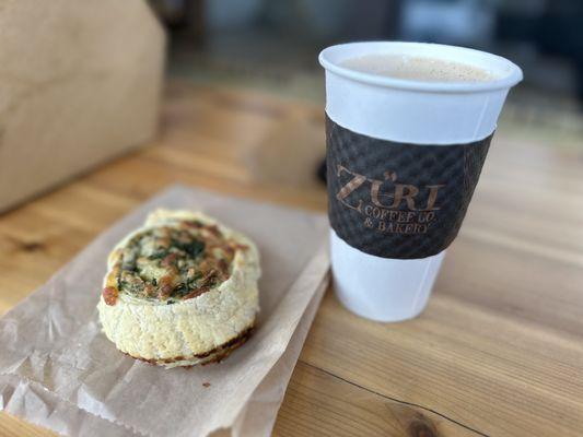 Artichoke and spinach roll and a latte