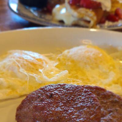 Perfect over medium eggs with sausage.