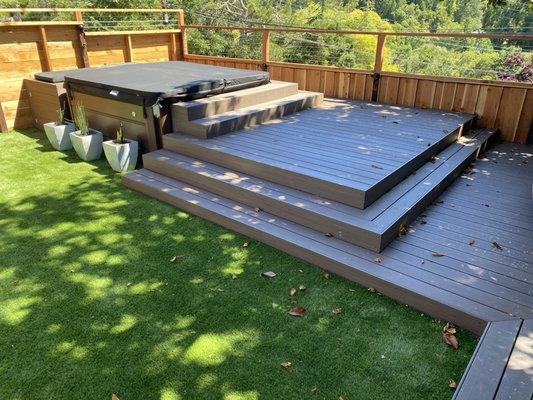 Multi-level deck with hot tub wrapped with "Azek" PVC in American Walnut