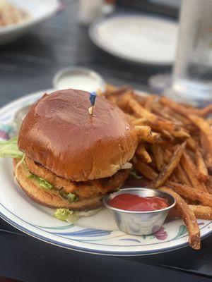 Salmon burger with side of fries.. handhelds are served al a carte.. very tasty