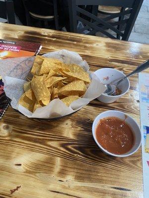 Chips and salsa with a sample of fish ceviche