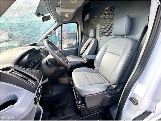 2018 Ford Transit cargo van. Has a secure metal partition behind the seats, which has a center panel that can be turned into a door.