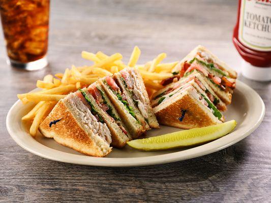 Clubhouse Sandwich - Triple-decker with sliced turkey, bacon, lettuce, tomato and mayonnaise on toasted Country White bread.