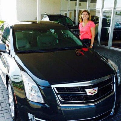 A loyal customer and her new Cadillac XTS!